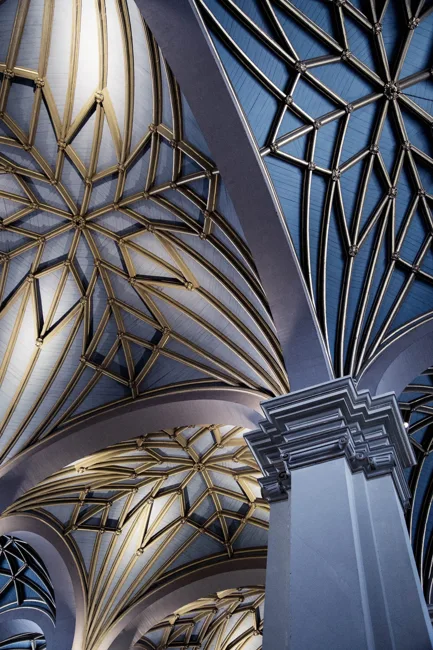 Ornate vaulted ceiling with gold-edged geometric decoration.